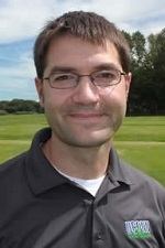 man with glasses and gray shirt